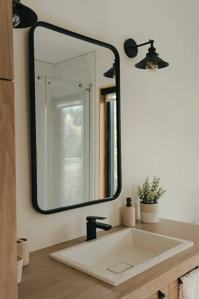 Mirror and sink in modern, updated bathroom - north Texas home rentals