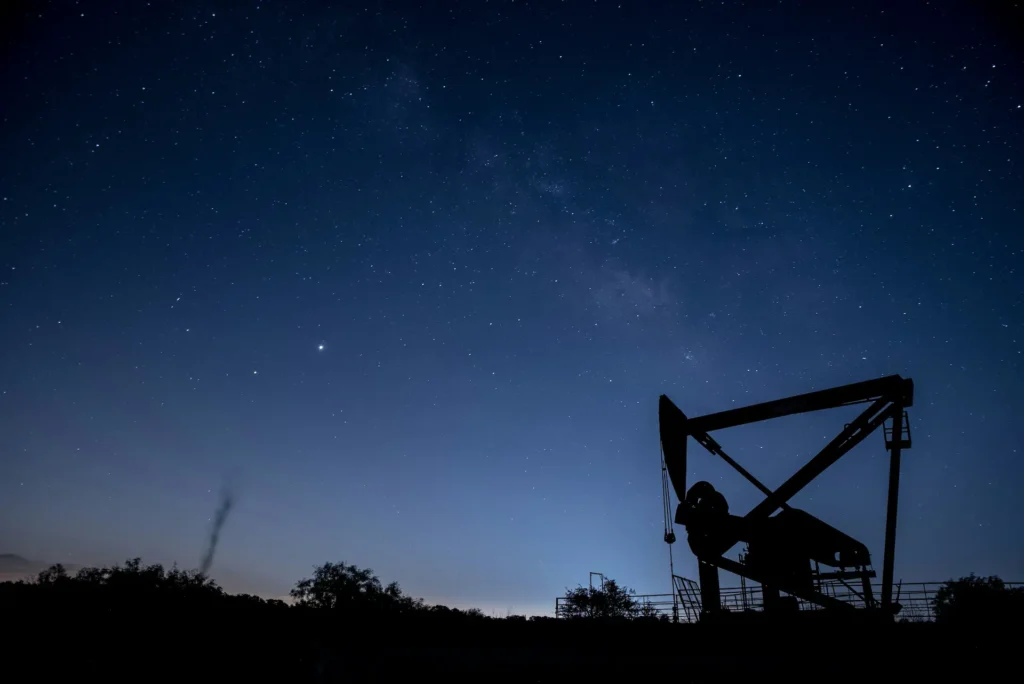 Texas living, pump jacks against a blue night sky