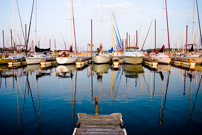 Marina at Lake Texoma: colorful sailboats in blue water off the end of dock